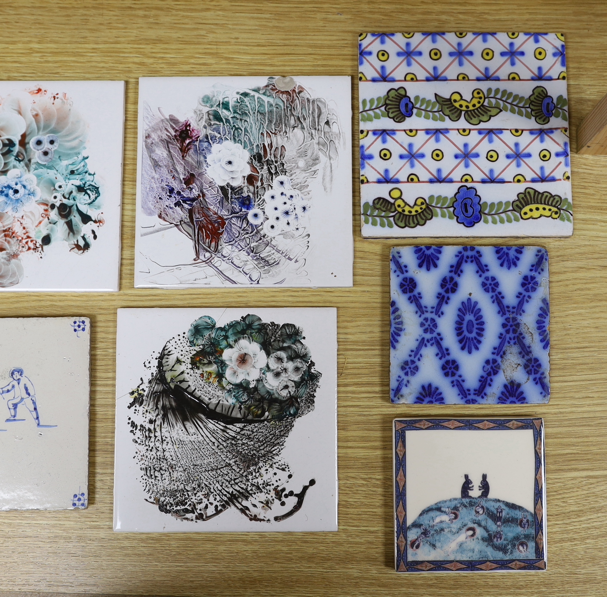 A group of tiles painted by Harold Elvin for H and R Johnson Ltd and earlier tin glazed tiles